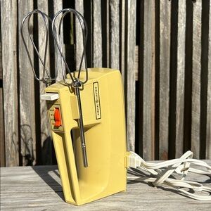 General Electric (GE) hand mixer, likely from the 1960s or 1970 in Harvest Gold